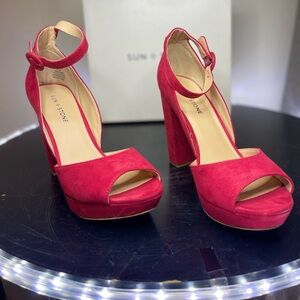 Hello. These Beauties are a 4 1/2 inch heel.Velvety soft red material from Macys